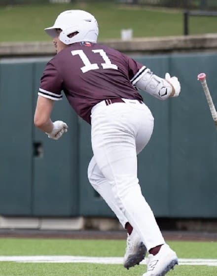 Blake Jackson running to first base after contact